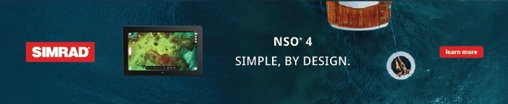 Top view of a boat on blue water with two people in a floating device tethered to the back, and a Simrad NSO 4 marine navigation display shown on left side.