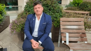 Wade Pearce sitting on a bench