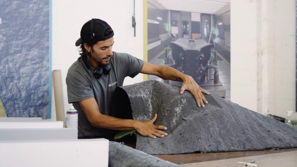 man working with recycled material