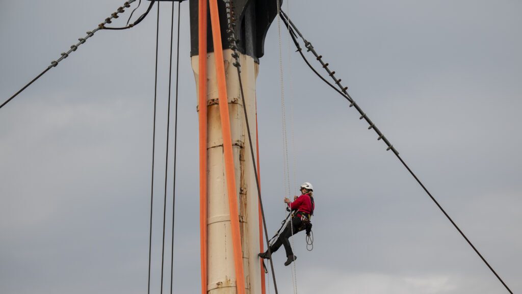 Connie Sheeran, rigger, up foremast of HMS Victory. Image courtesy of Matt Sills