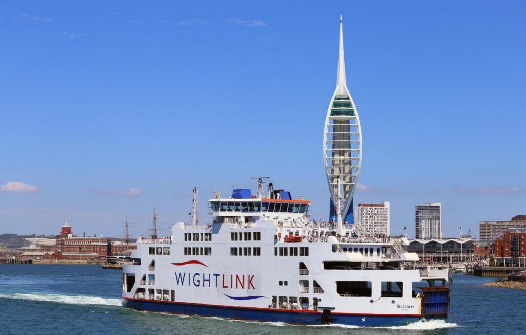 ferry in Portsmouth Harbour under Spnnaket Tower
