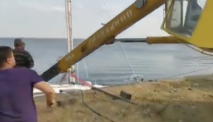 WATCH: Falling crane sinks yacht