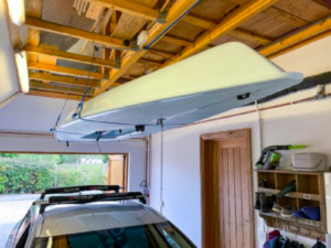 Barton Marine skydock lifts canoe to store in garage