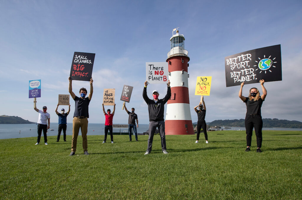 SailGP athletes holding clean energy signs