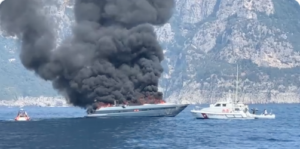 Superyacht billowing smoke off the Italian coast