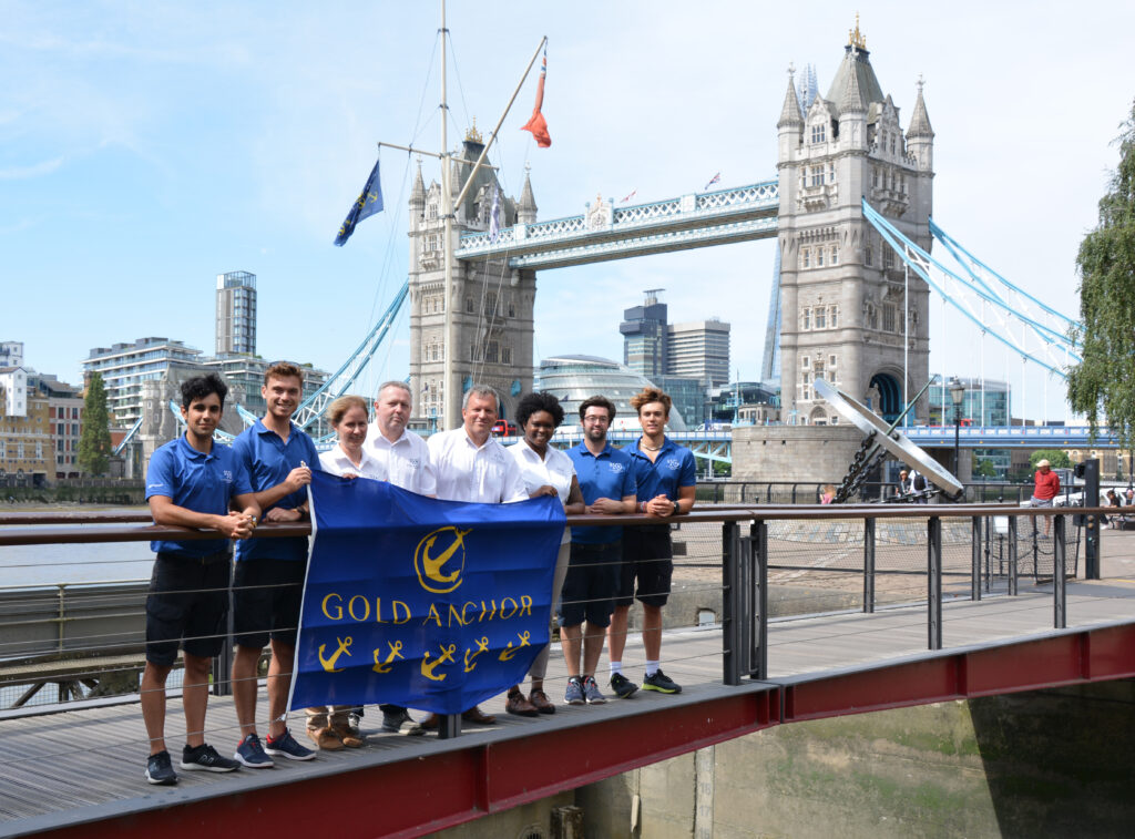 St Katherine Docks team poses at Tower Bridge