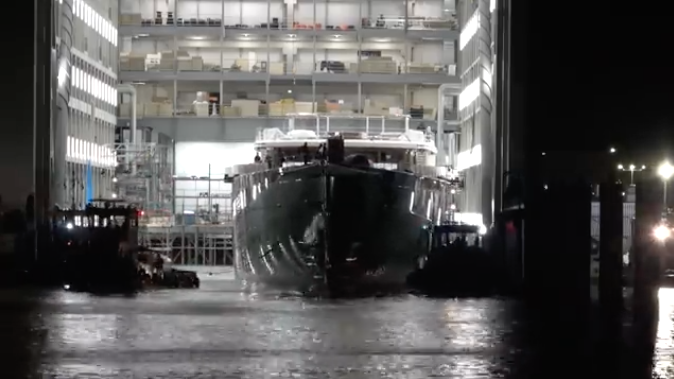 Jeff Bezos Superyacht leaving shipyard shed in the dark