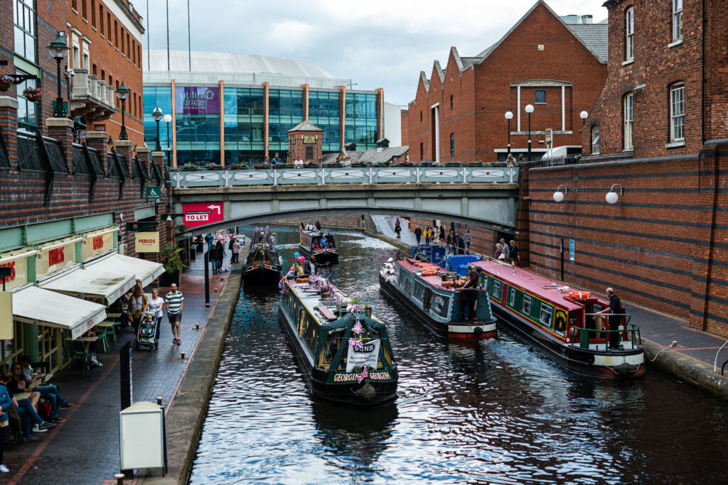 three canal boats taking part in a boating parade in Birmingham