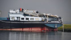 cargo ship after wheelhouse destroyed by bridge