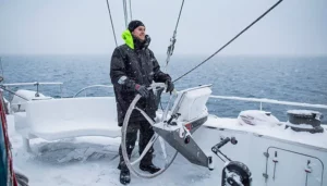 Mats in the Arctic Ocean Parka at the helm.