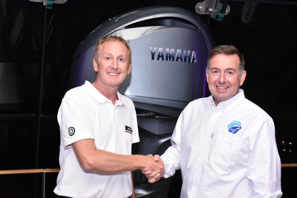 Matt Taylerson, Yamaha, shakes hands with Ross Honey, MD Angling Spirit