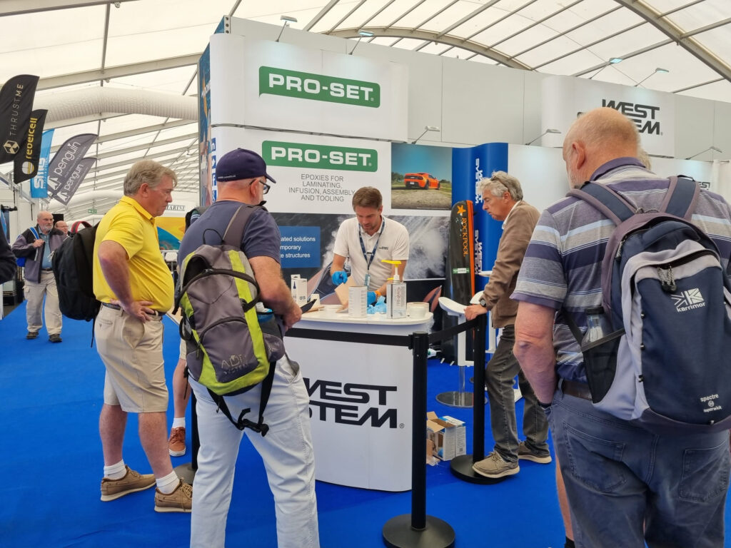 People gathered round a stand at a boat show