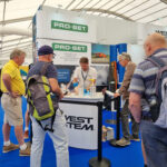 People gathered round a stand at a boat show