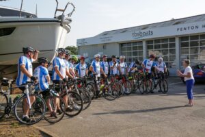Group of cyclists outside a commercial building