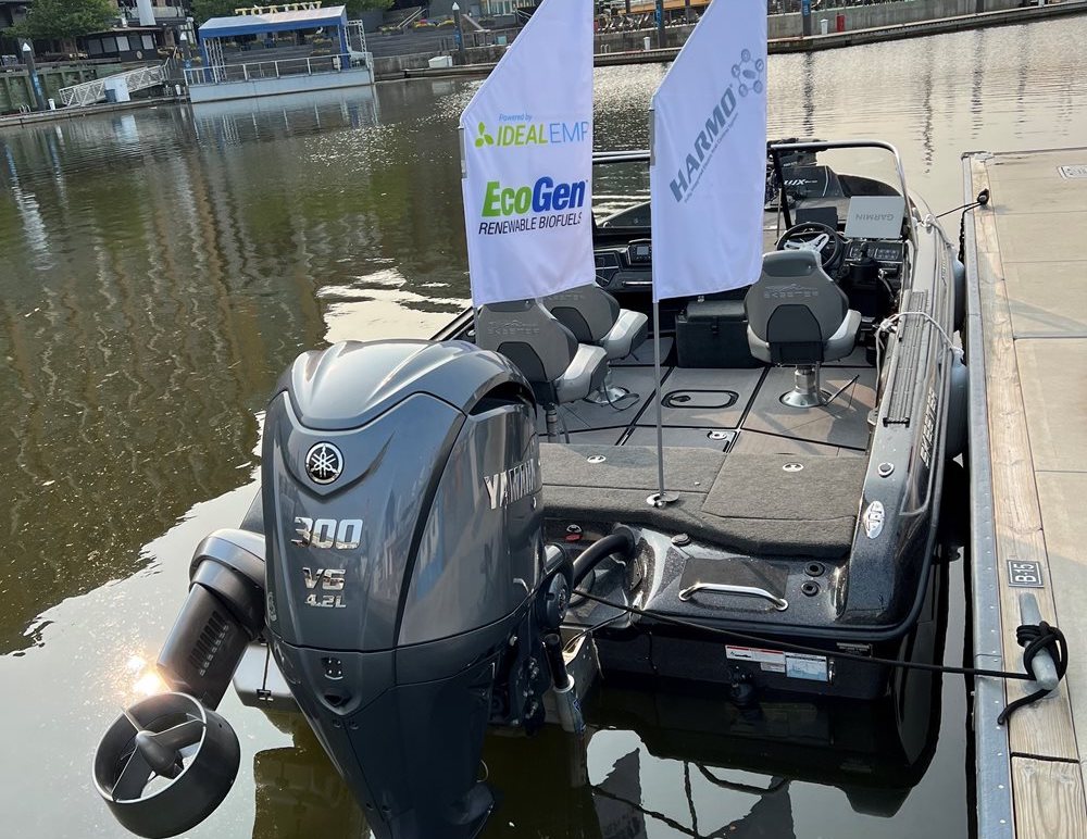Motor boat with Yamaha outboard and electric outboard and flags