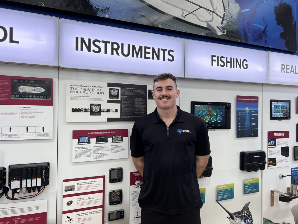 man in front of marine product exhibition stand