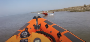 Small plane in sea with lifeboat