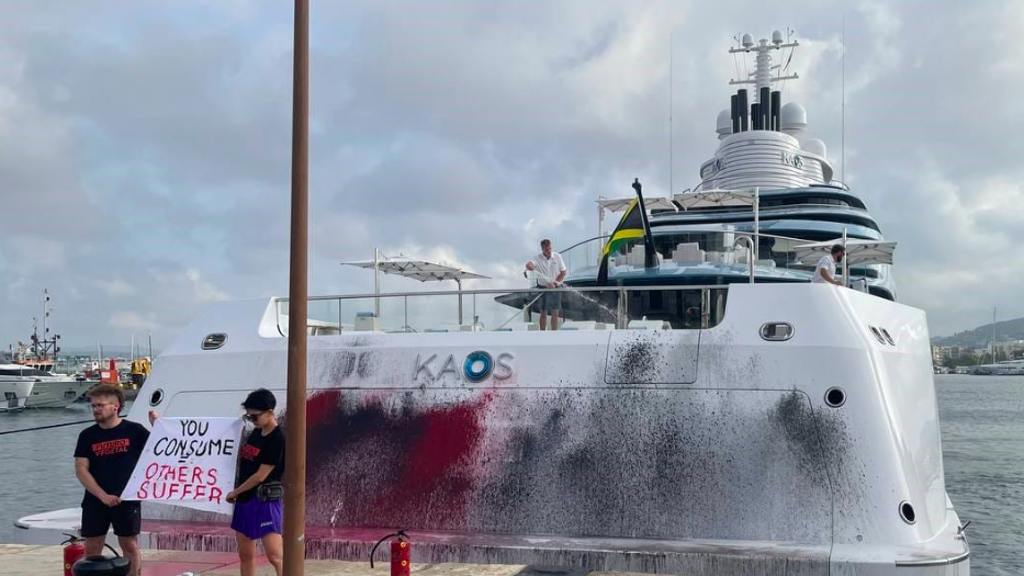 Image of paint sprayed on superyacht in Ibiza by protestors. Yacht belongs to Walmart heiress