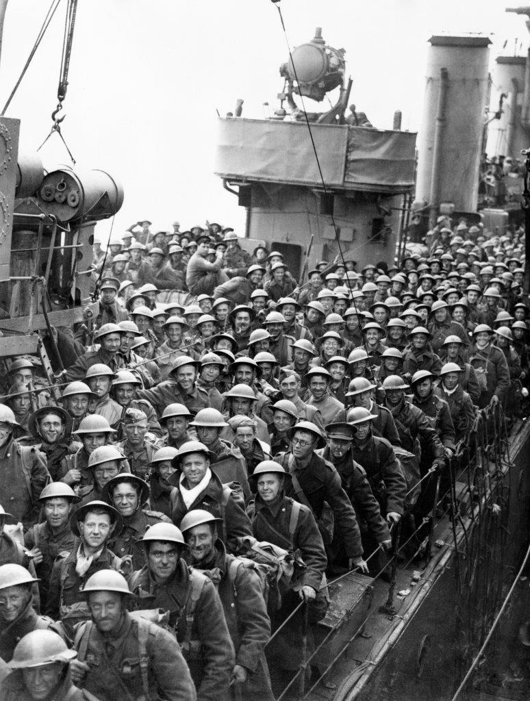 Evacuated British soldiers on board a destroyer are landed at Dover and wait to disembark.