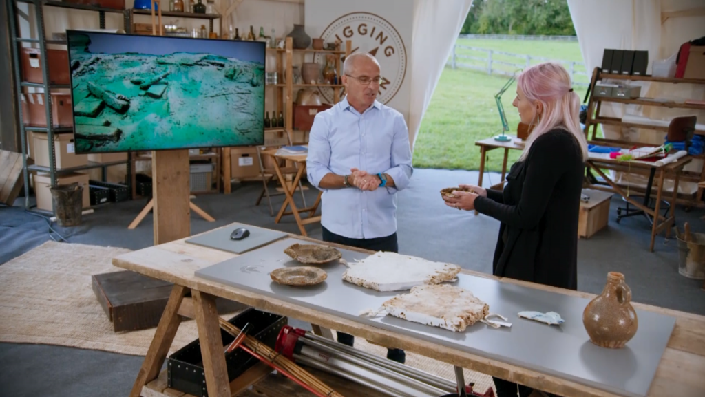Mark Beattie-Edwards from the Nautical Archaeology Society discusses the finds at the wreck site with Professor Alice Roberts in the Digging for Britain tent © RareTV & BBC
