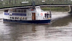 A boat full of West Ham fans collides with Hammersmith Bridge.