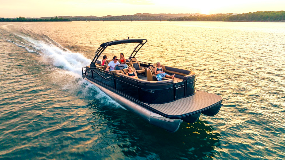 Lowe Boat's new pontoon boat on water featuring family and friends at sunset
