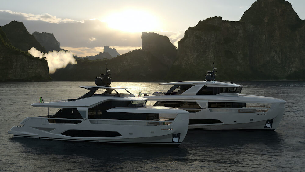 Side view of two luxury motor yachts moored off Italian coast.