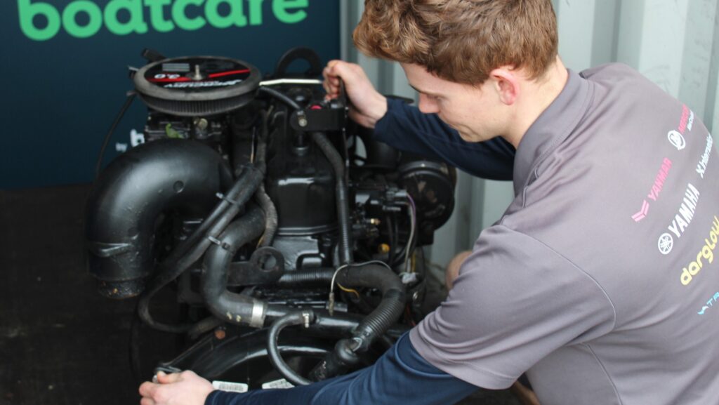 chap fixing an engine