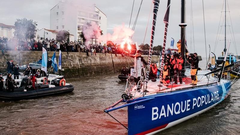 Skipper Clarisse Cremer, Banque Populaire X, is pictured celebrating with flares in the channel during arrival of the Vendee Globe sailing race, on February 2 - photo © Jean-Louis Carli and Alea