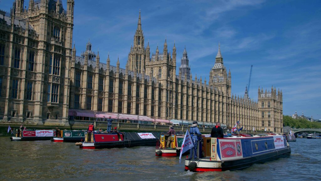 narrowboats join a flotilla at Westminster to prod the government into action on savign waterways