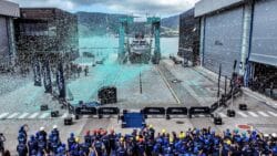 Riva shipyard with confetti raining down on luxury superyacht