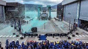 Riva shipyard with confetti raining down on luxury superyacht