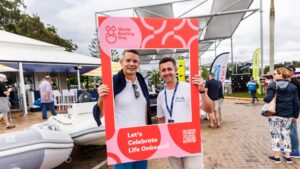 People pose during World Boating Day 2024