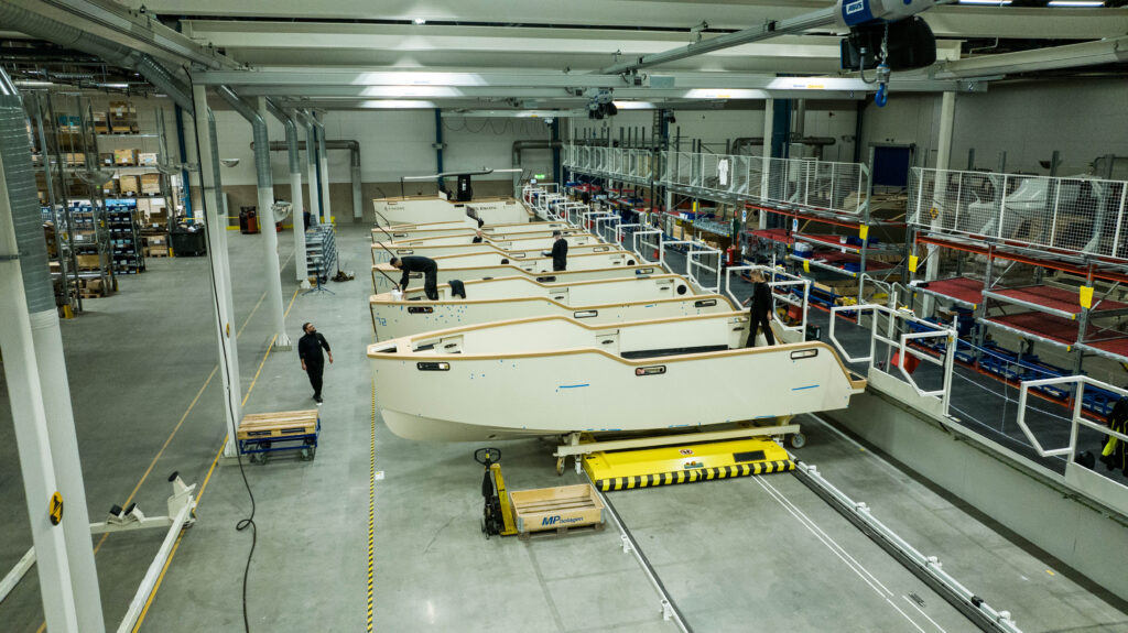 Boats on production line in factory