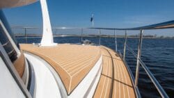 looking along the bow and teak deck of a luxury yacht