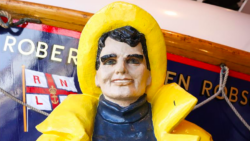 Terrifying figure of man doll in yellow hood