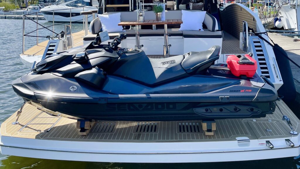 jet ski on chocks on back of boat