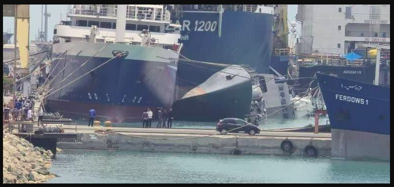 Iranian Navy's Sahand destroyer frigate sinks in Iran port. Ship lies on side next to other vessels