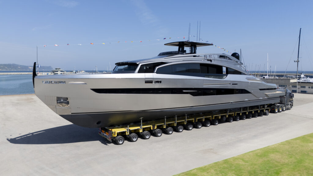 grey and black Pershing motor yacht in shipyard for launch