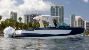 Aviara boat shown on water with city backdrop as MarineMax enters into agreement to take over brand