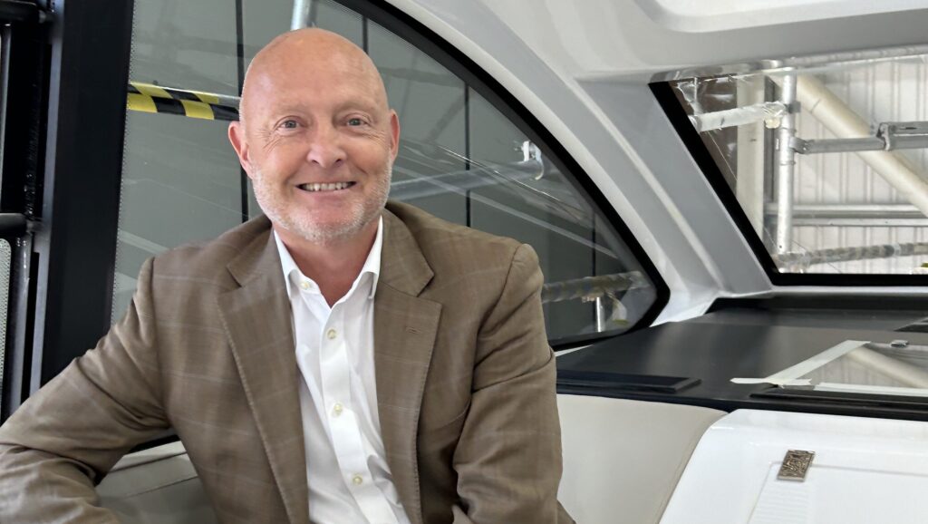 Bryan Jones sitting in interior of Fairline motor yacht