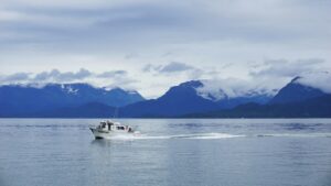 Boat sails on water in Homer, Alaska