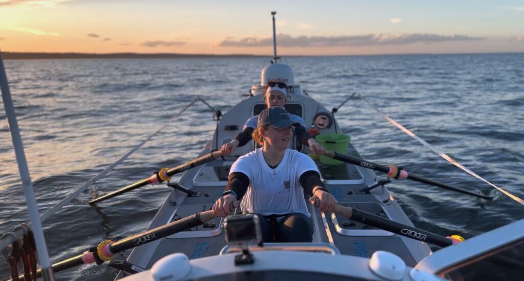 Two rowers in action on boat they play to row unsupported across Pacific Ocean in Seas the Day team effort