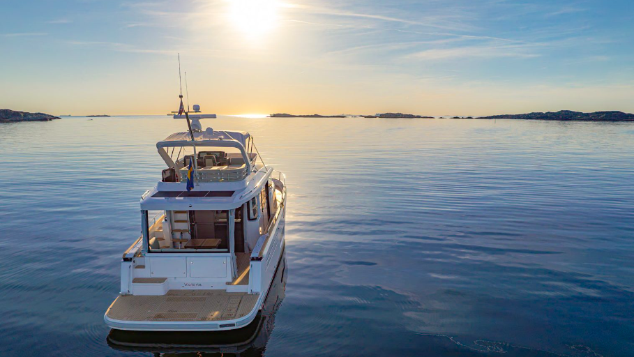 stern of Nimbus 495 Flybridge in sunset on calm waters