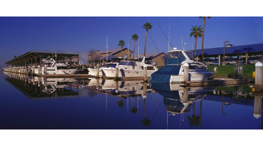 View of marina and boats in dusk. This is Suntex latest buy - discovery bay - in California as company continues aggressive expansion