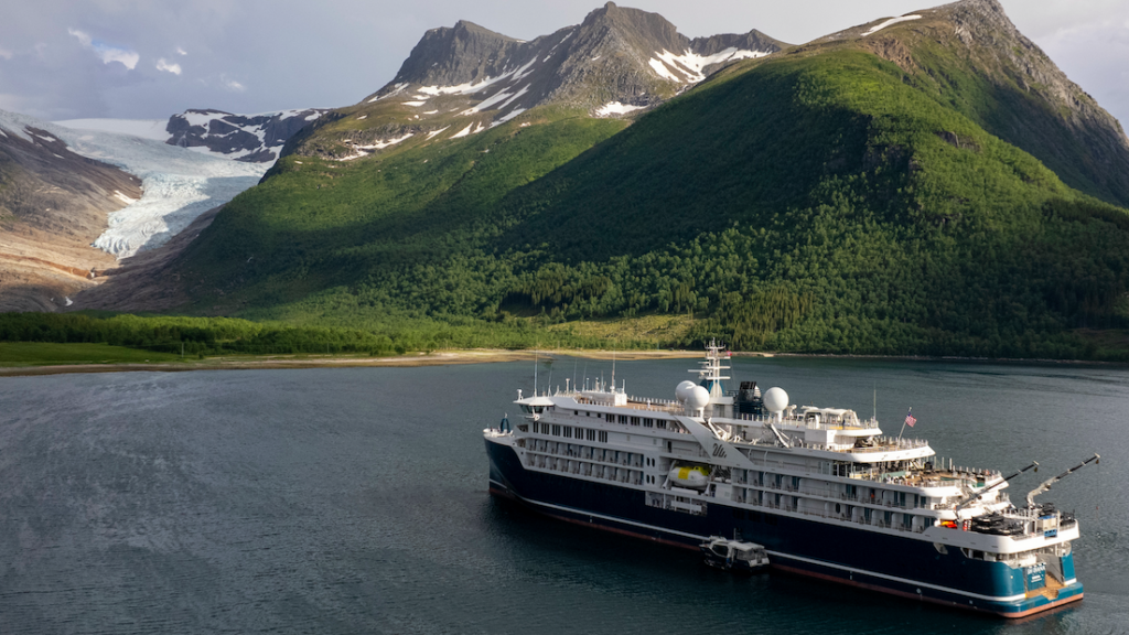 SH Diana pictured with mountains and glacier in background - a different cruise to the one where passengers are now on a hunger strike