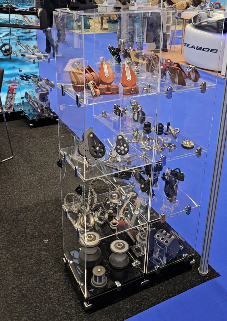 Barton Marine vertical display stand showing many sailing products all of which have to be weighed and measured and added to a carnet to take to European exhibitions. Brexit has made exhibiting in EU much more difficult for UK marine companies