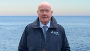 man standing in front of the sea