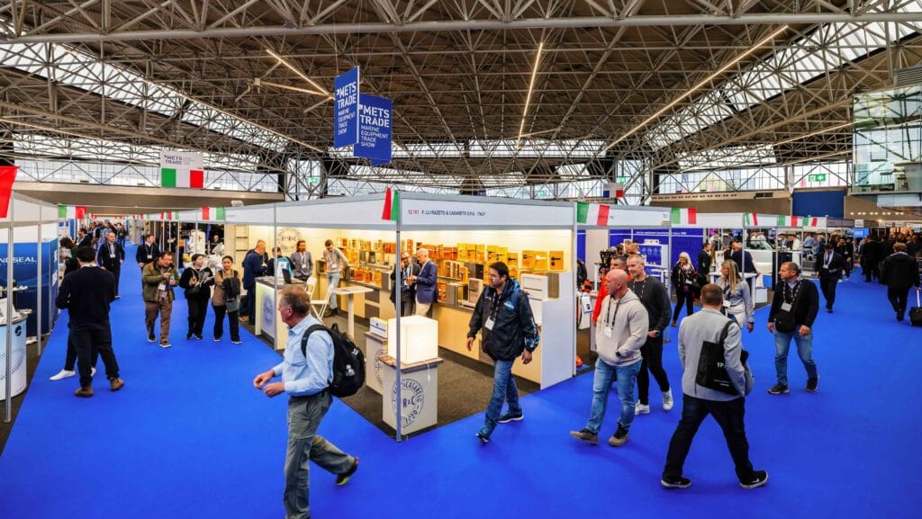 Exhibition hall at Metstrade marine trade fair showing booths and people walking around