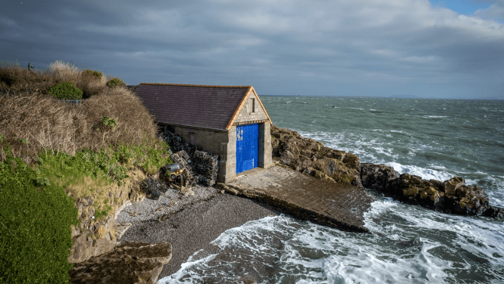 a lifeboat station on cliffside with blue door. This was once manned by cannibal Thomas Lewis